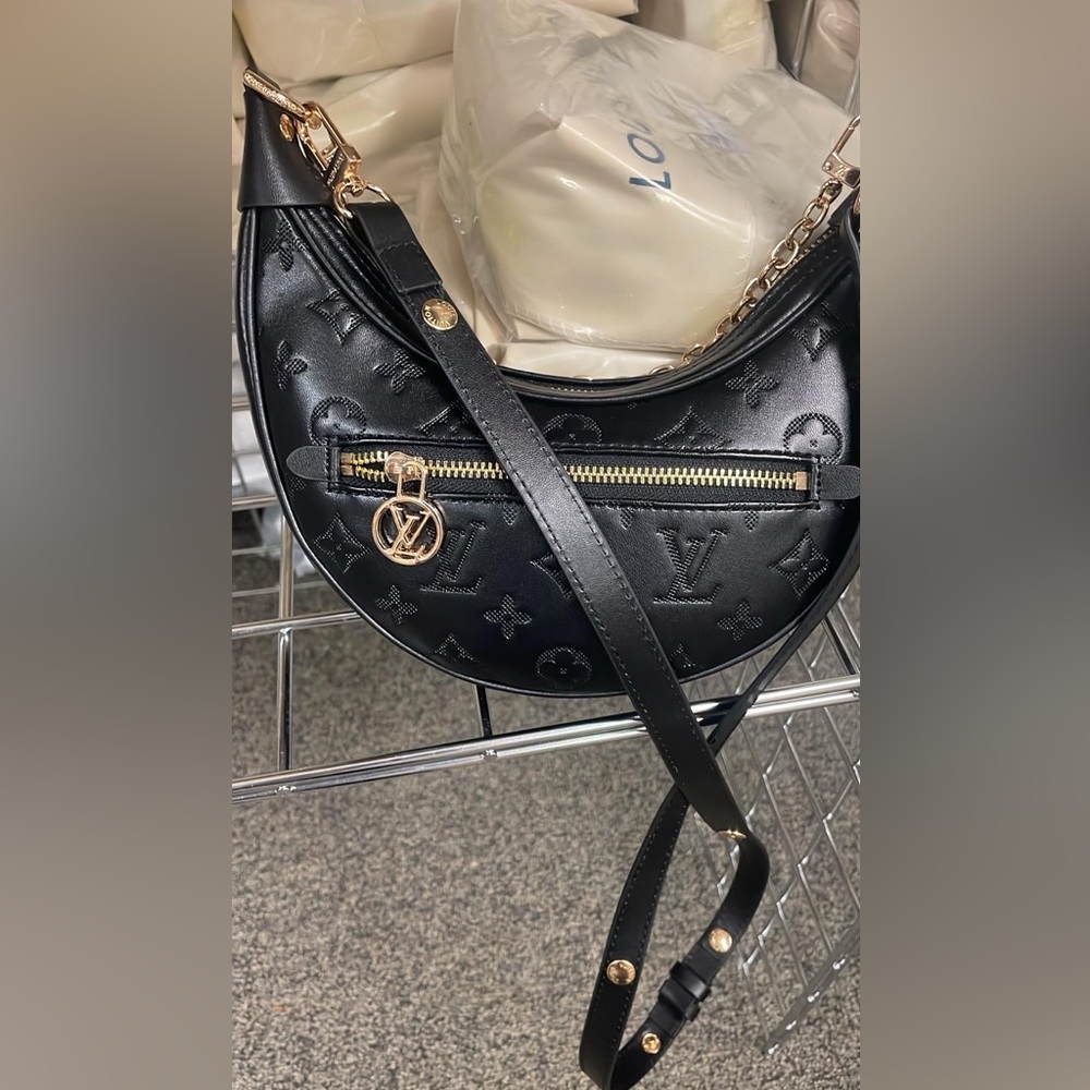 Black Embossed Crescent Shoulder Bag with Gold Accents